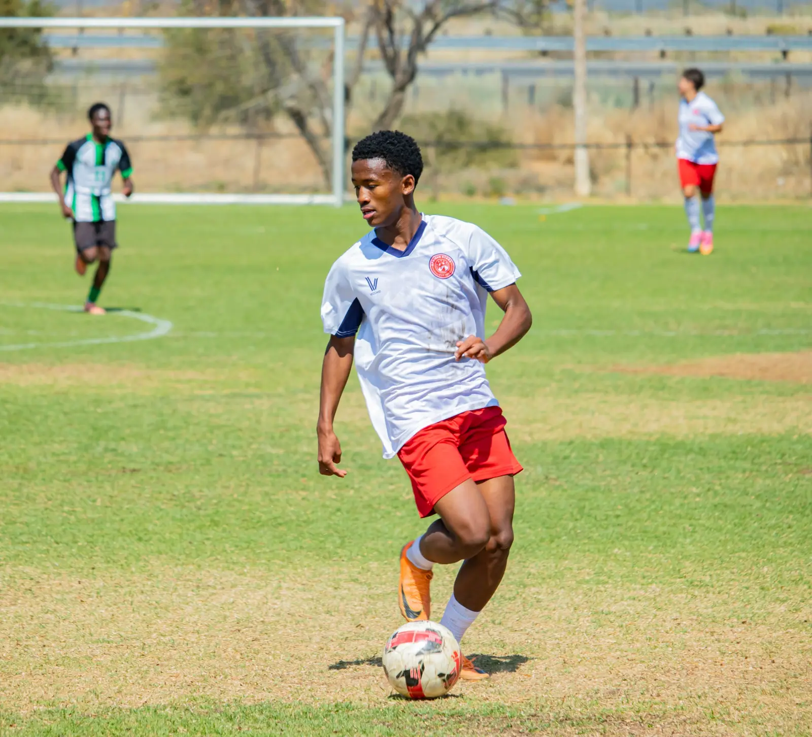 Nathan Goliath controlling the ball during a youth match